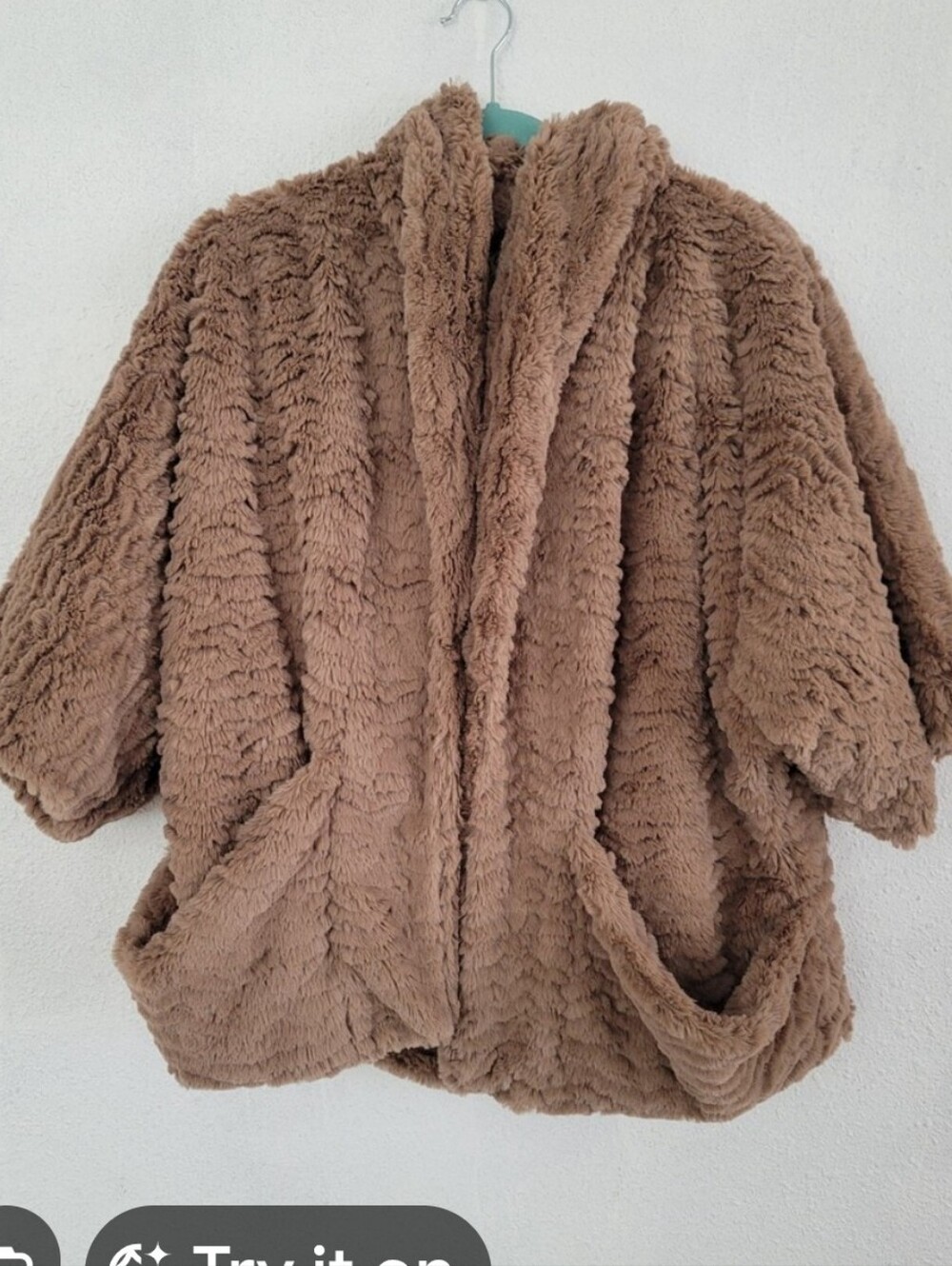 Jolt brand faux fur teddy jacket featuring a plush tan texture and front pockets
